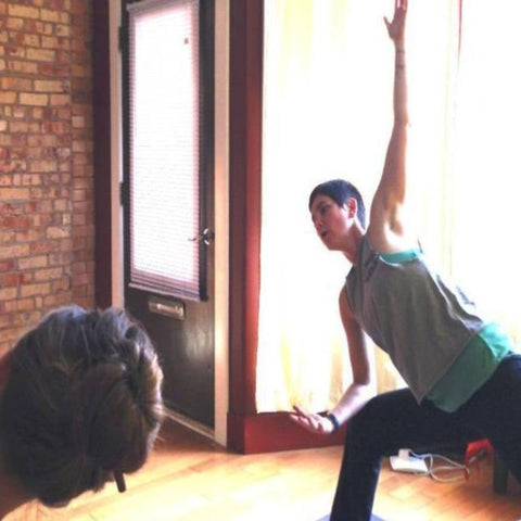 L.A.I. guiding a yoga practice at Just B Yoga in Lansing. Photo Credit: Just B Yoga.