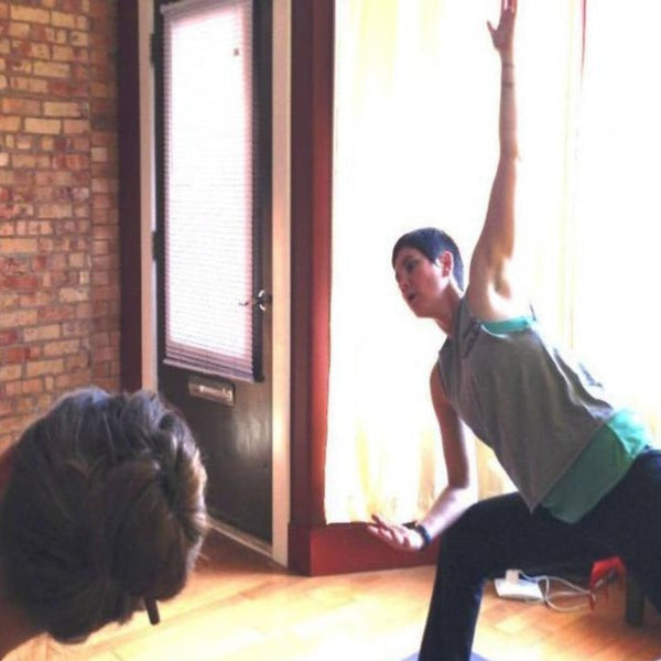 L.A.I. guiding a yoga practice at Just B Yoga in Lansing. Photo Credit: Just B Yoga.